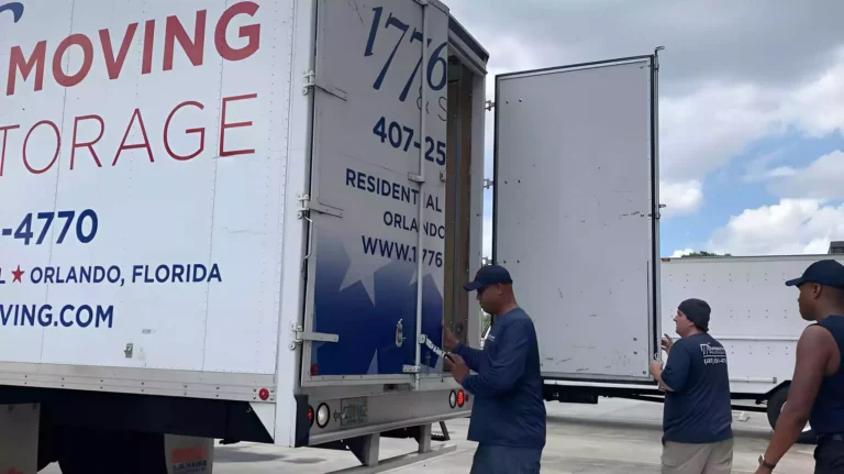 1776 Moving and Storage crew beside their moving truck