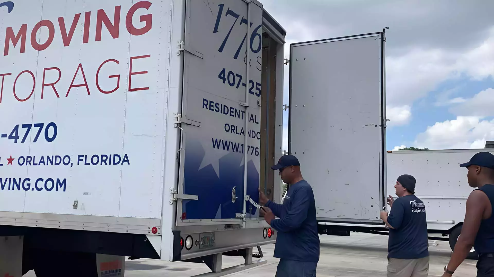 1776 Moving and Storage crew loading boxes into a moving truck in Orlando, FL