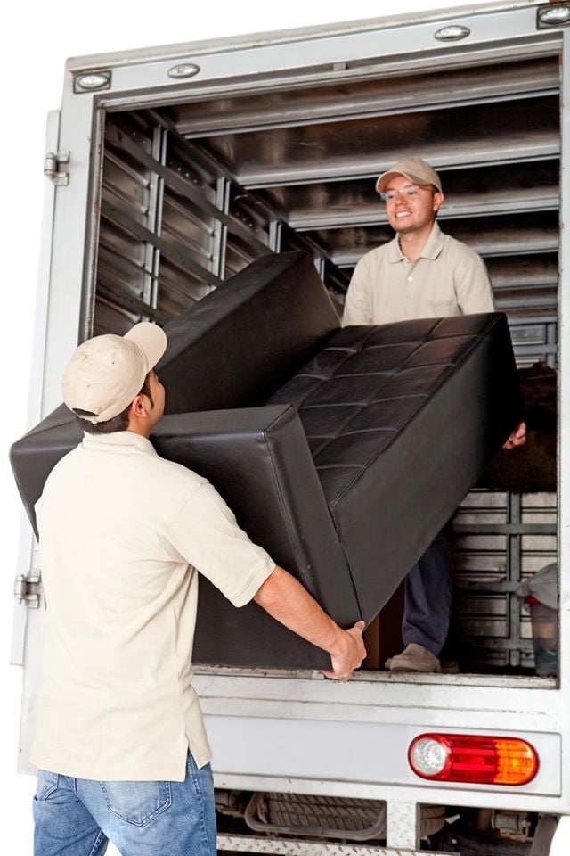 Movers in Orlando holding couch